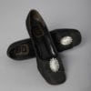 Paire de chaussures noires et boucles en strass griffées Souliers Christian Dior