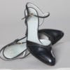 Paire de chaussures en cuir noir à Lanières griffées Christian Dior