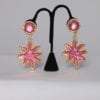 Paire de boucles d'oreille en métal doré et rose