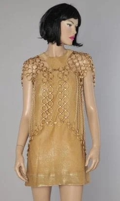 Gilet en chaînes et anneaux métalliques doré