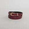 Ceinture en crocodile rouge et boucle dorée