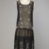 Robe 1925 en mousseline noire brodée de perles blanches et argent