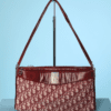 Sac Christian Dior en toile rouge et beige et cuir rouge