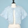 Boléro en nylon bleu ciel à froufrous