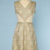 Robe 1960 en lainage écru sur robe lamé or à carreaux verts