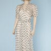 Robe 1930-1940 en mousseline de soie blanche à pois noirs