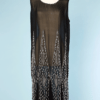 Robe 1925 en mousseline noire brodée de perles de verre transparentes