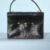 Sac 1967 en crocodile porosus modèle palonnier griffé Hermès