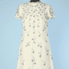 Robe 1960 de cocktail en crêpe jaune pâle brodée de notes de musique