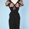 Robe 1940 en crêpe noir et fleurs roses appliquées