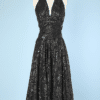 Robe 1950 en coton laqué de motifs noirs et or