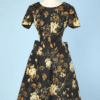 Robe 1950 en satin de soie noire imprimée de fleurs jaunes et feuillages marron