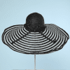 Immense capeline vintage en paille noire et blanche