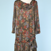 Robe 1925 en soie lamée or imprimée de fleurs