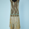 nA4637-Robe-1925-en-dentelle-métallique-or-brodée-de-perles-turquoises-t42-01